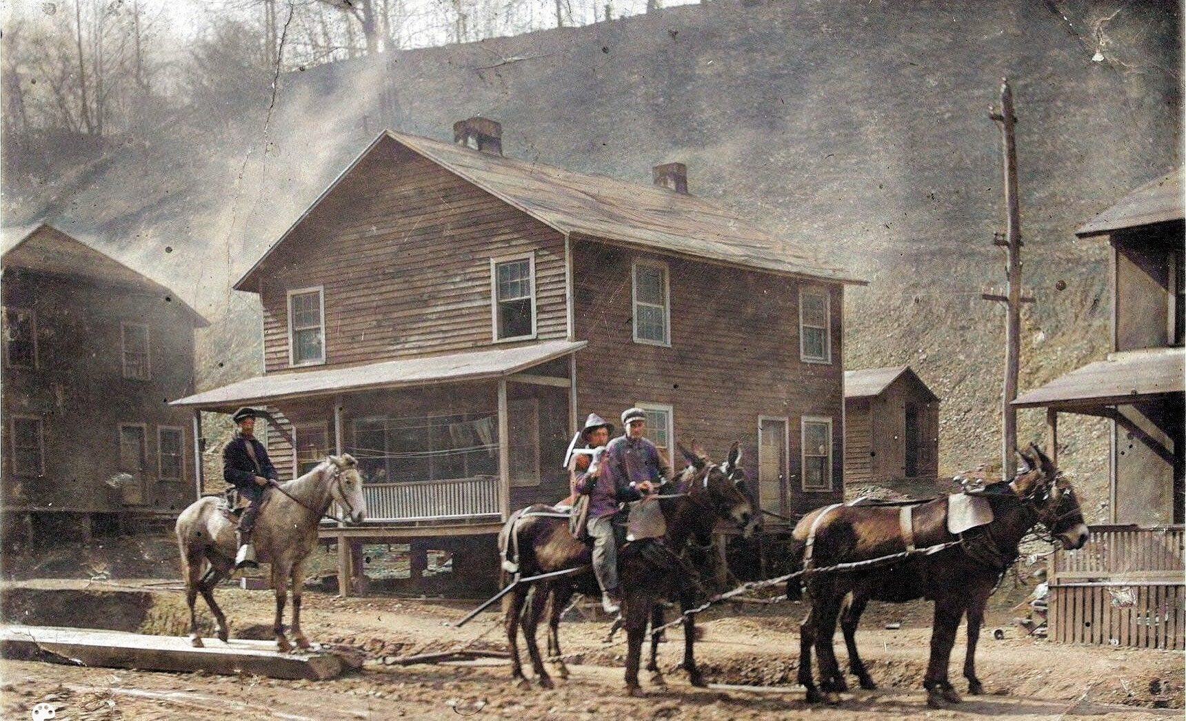 Maryland Isaac (on horse with pick) in Weeksbury. Other men unidentified